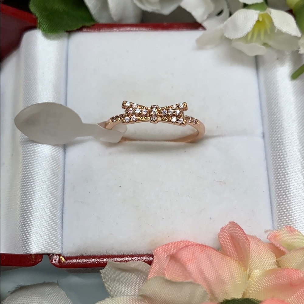 NWT rose gold colored bow ring size 8